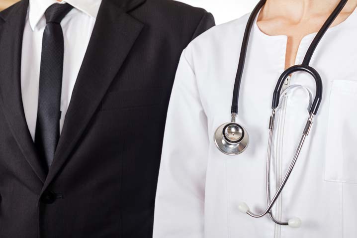 doctor standing next to businessman