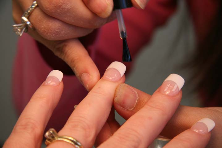 woman getting nails done